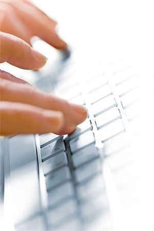Writing a publication on a laptop